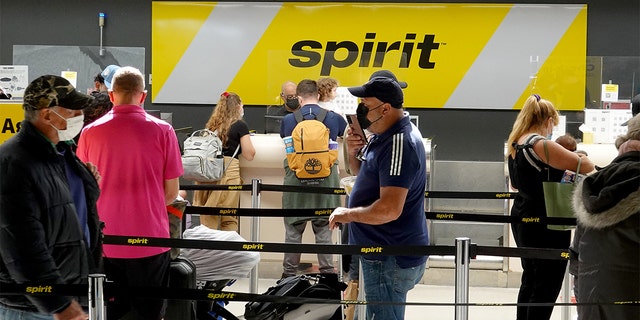 ssengers check in at the Spirit Airlines counter at the Fort Lauderdale-Hollywood International Airport on Feb.  07, 2022 in Fort Lauderdale, Florida. 