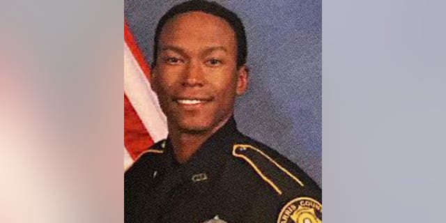 Deputy Constable Omar Ursin was shot and killed while off-duty and driving home from picking up dinner for his family, authorities said.  Two men, both 20, have been arrested in connection with his shooting death. 