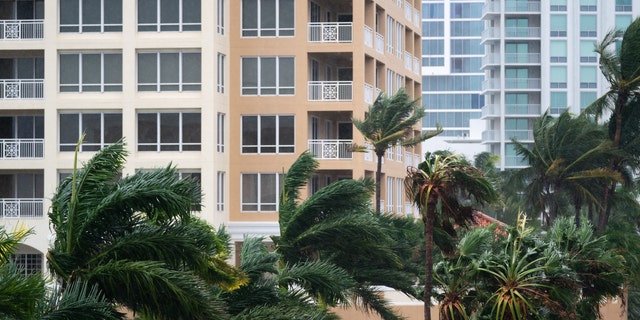 SARASOTA, FL - SEPTEMBER 28: Wind gusts blow between condominiums as Hurricane Ian churns to the south on September 28, 2022 in Sarasota, Florida.  The storm made a US landfall at Cayo Costa, Florida this afternoon as a Category 4 hurricane with wind speeds over 140 miles per hour in some areas. 